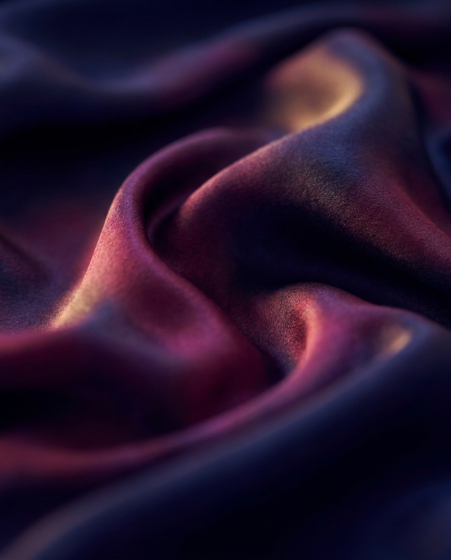 Rippling indigo and plum silk in low light